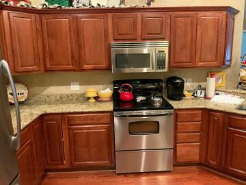 Before picture of a cabinet painting project done by Chagrin Home Improvements